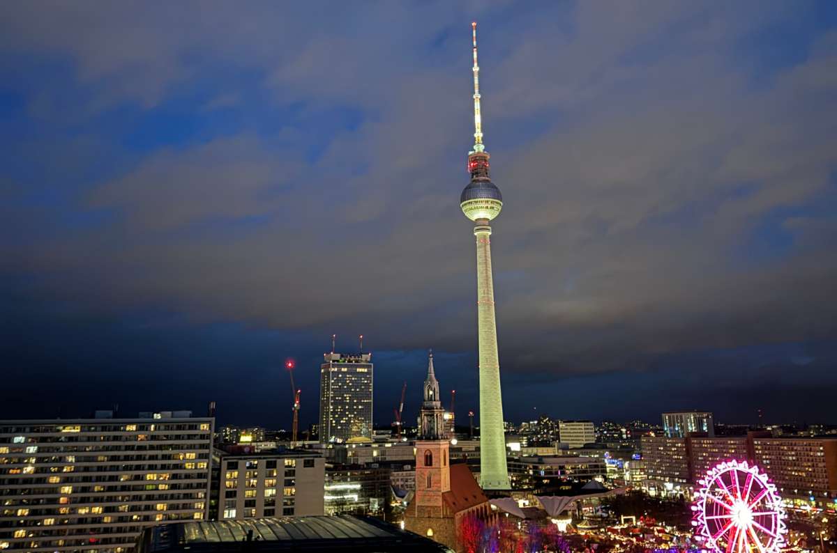 A photo showing the Berlin TV Tower and the city skyline at night, Germany, a photo by Next Level of Travel