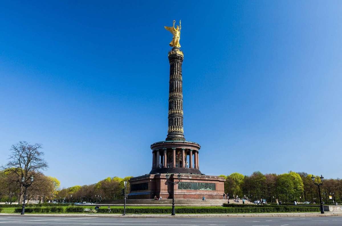 A photo showing the Berlin Victory Column under a clear blue sky in Berlin, Germany