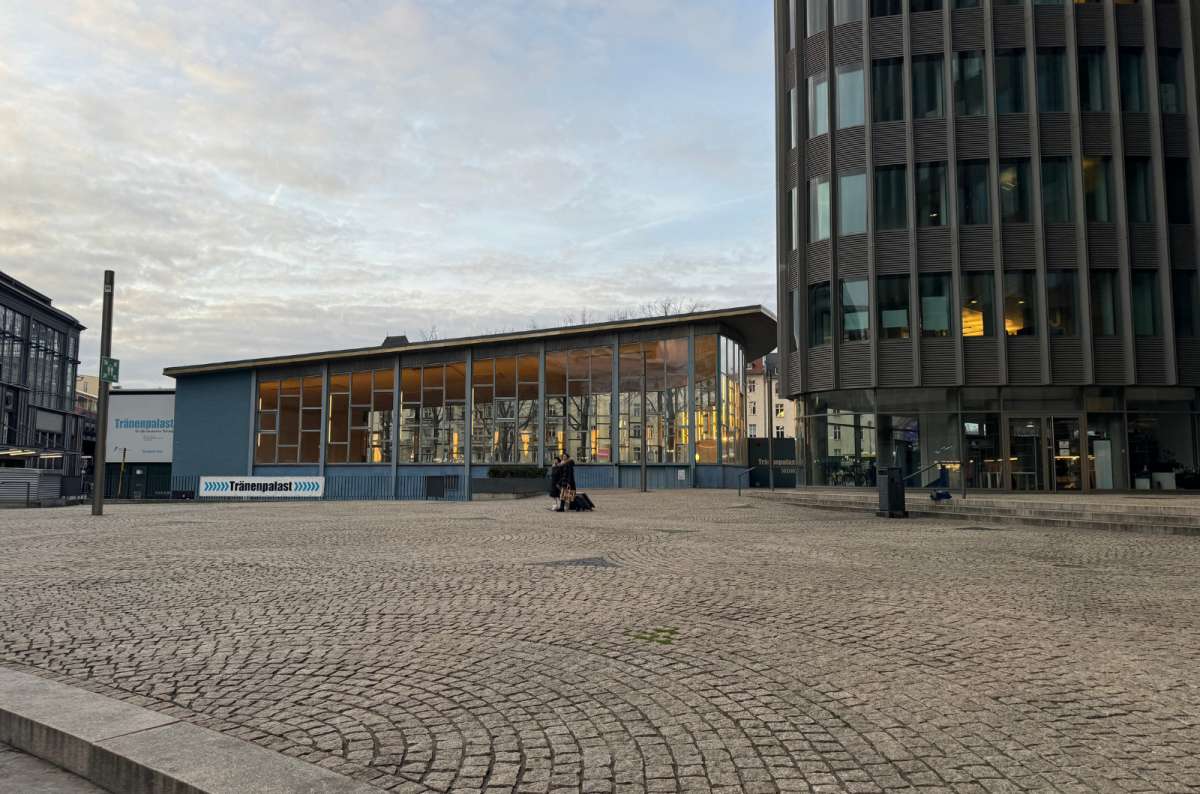 A photo showing the glass and steel pavilion of the Tränenpalast museum in Berlin, Germany, a photo by Next Level of Travel