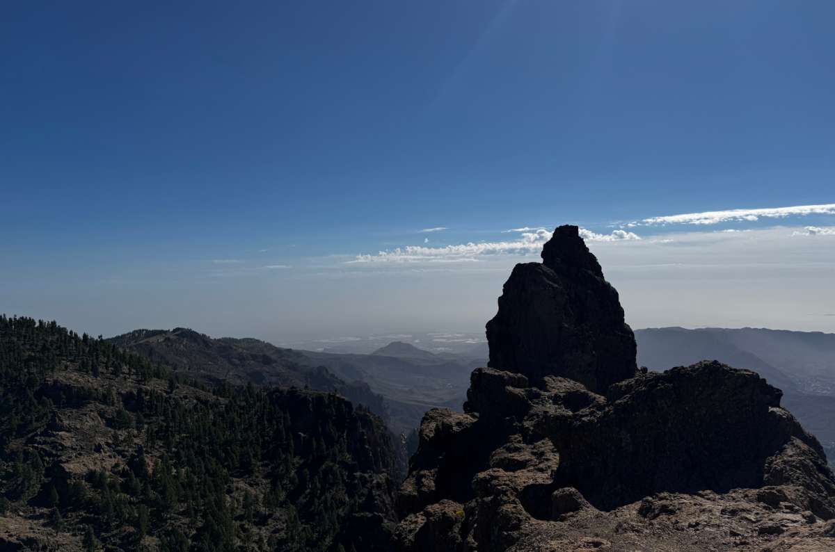 a photo of a close-up photo of the summit of Pico de Las Nieves, showing the mountain peak and the panorama beyond, Canary Islands, photo by Next Level of Travel