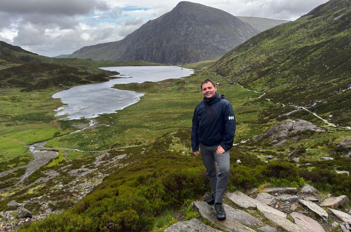 a photo of a tourist on a rocky path above Llyn Idwal, Snowdonia, Wales, photo by Next Level of Travel