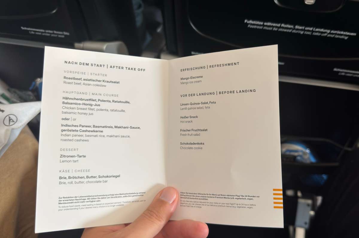 a photo of the bilingual Condor Premium Economy menu with lunch and pre-landing meal options, photo by Next Level of Travel