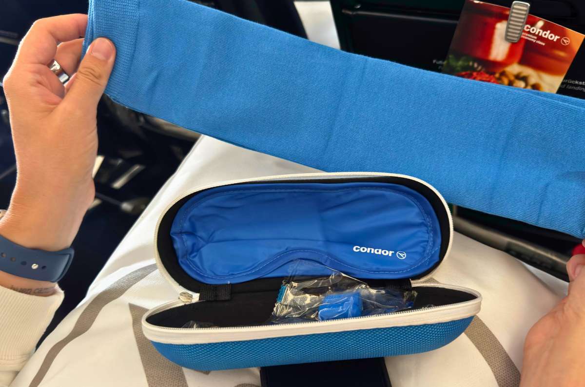 a photo of the Condor Premium Economy amenity kit with an eye mask, earplugs and socks in a hard zip case, photo by Next Level of Travel
