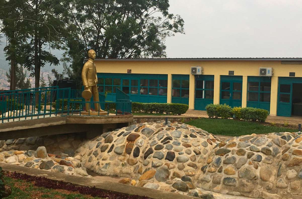 a photo of a golden statue outside the Kandt House Museum in Kigali, Rwanda