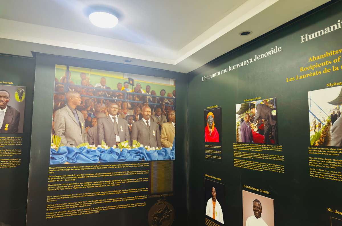 a photo of an exhibition wall displaying photographs and stories of people involved in the 1994