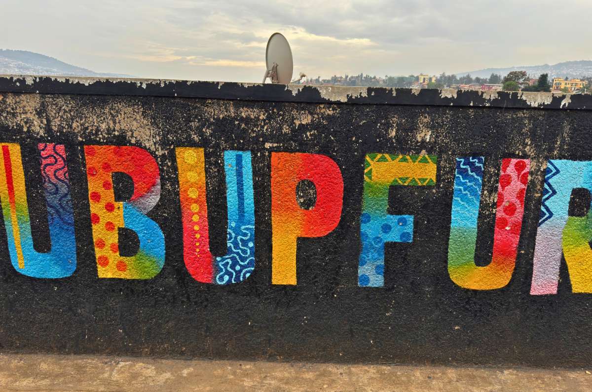 a photo of colorful UBUPFURA street art painted on a wall in Kigali, Rwanda, a photo by Next Level of Travel