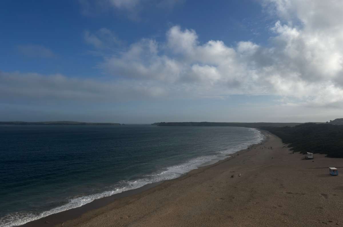 a photo of the long sandy stretch of Tenby South Beach seen from above, Wales, photo by Next Level of Travel