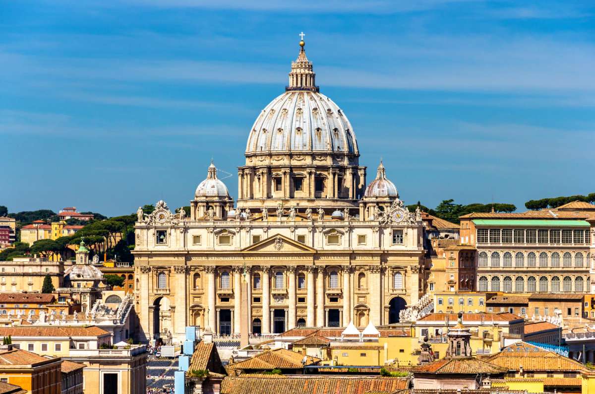 a photo of the facade and great dome of St. Peter's Basilica rising above the Vatican, Vatican City