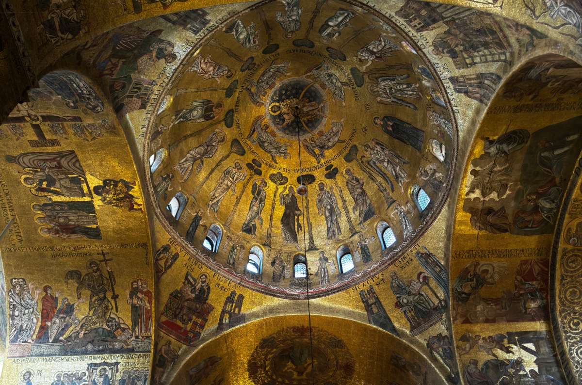 a photo of the golden Byzantine mosaics covering the domes inside St. Mark's Basilica, Venice, Italy, photo by Next Level of Travel