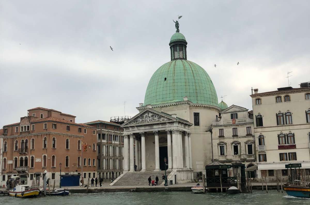 a photo of the green-domed San Simeone Piccolo church across the Grand Canal opposite the train station, Venice, Italy, photo by Next Level of Travel