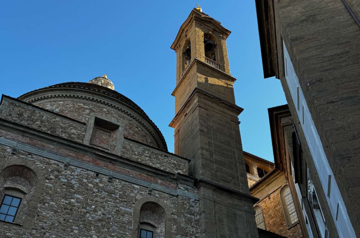 photo of the rough stone walls, dome and bell tower of the Basilica of San Lorenzo, Florence, Italy, photo by Next Level of Travel