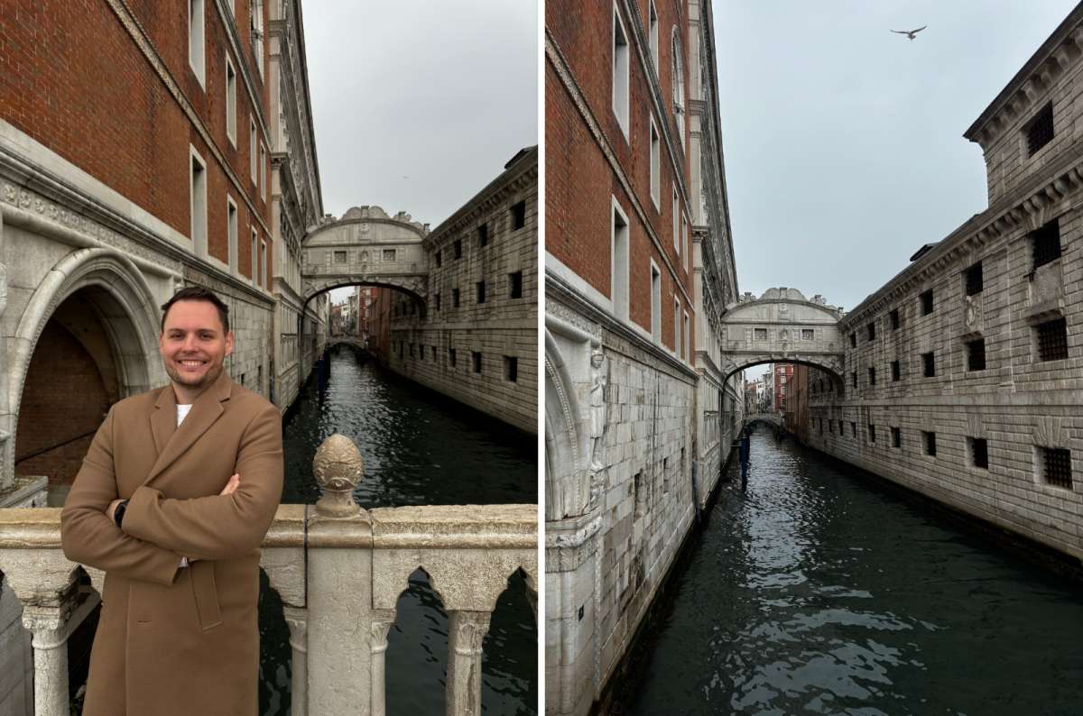 photo of a tourist on Ponte della Paglia on the left and the Bridge of Sighs between Doge’s Palace and the prisons on the right, Venice, Italy, photo by Next Level of Travel