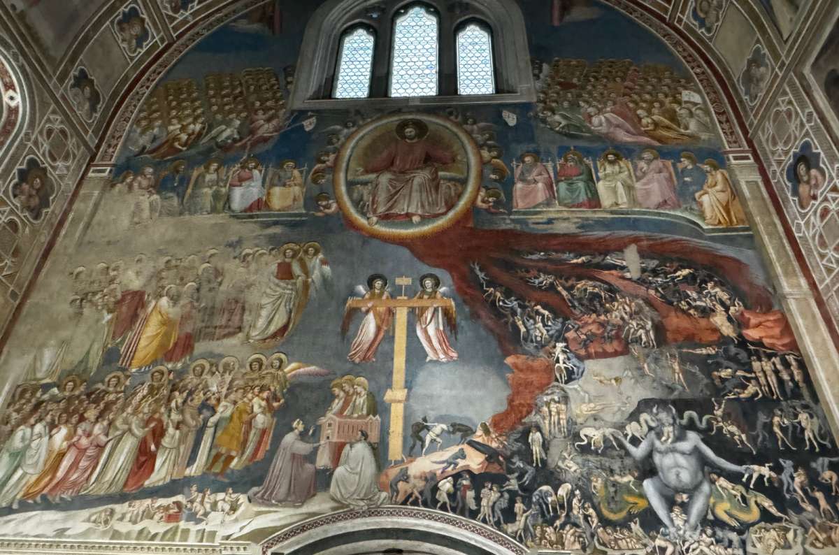 a photo of Giotto's Last Judgment fresco covering the entrance wall of the Scrovegni Chapel, Padua, Italy, photo by Next Level of Travel