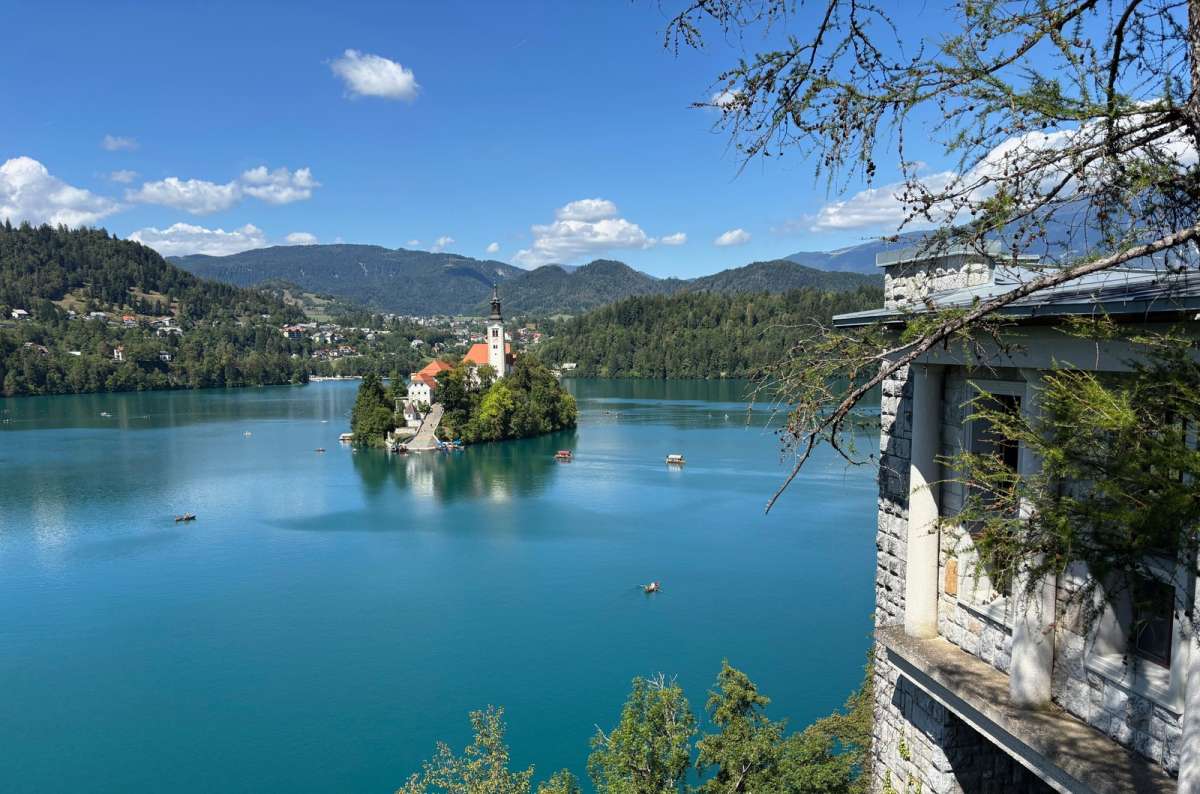 a photo of Bled Island and its church seen from the Belvedere terrace above Lake Bled, Slovenia, photo by Next Level of Travel
