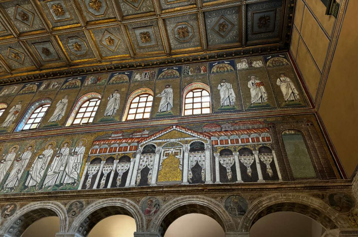a photo of the gold mosaic procession of saints above the arches of the Basilica of Sant'Apollinare Nuovo, Ravenna, Italy, photo by Next Level of Travel