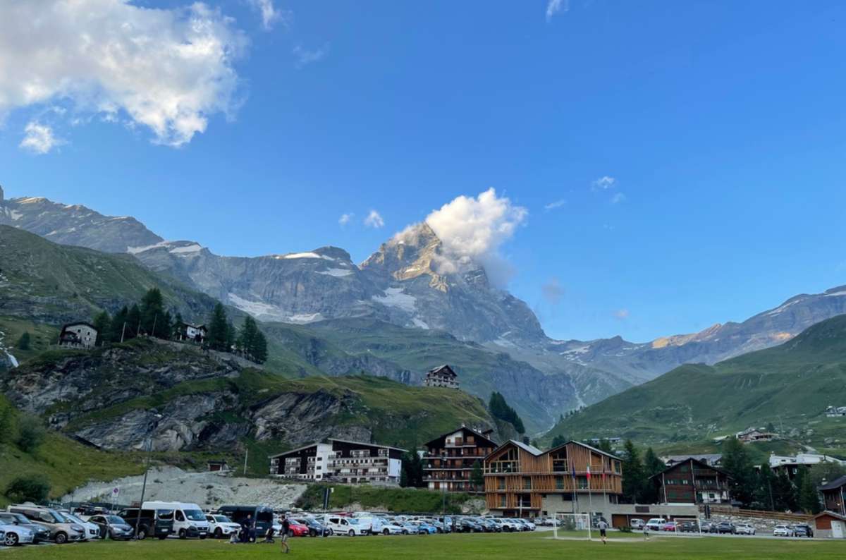 a photo of the Matterhorn rising above the village of Breuil-Cervinia, Aosta Valley, Italy, photo by Next Level of Travel
