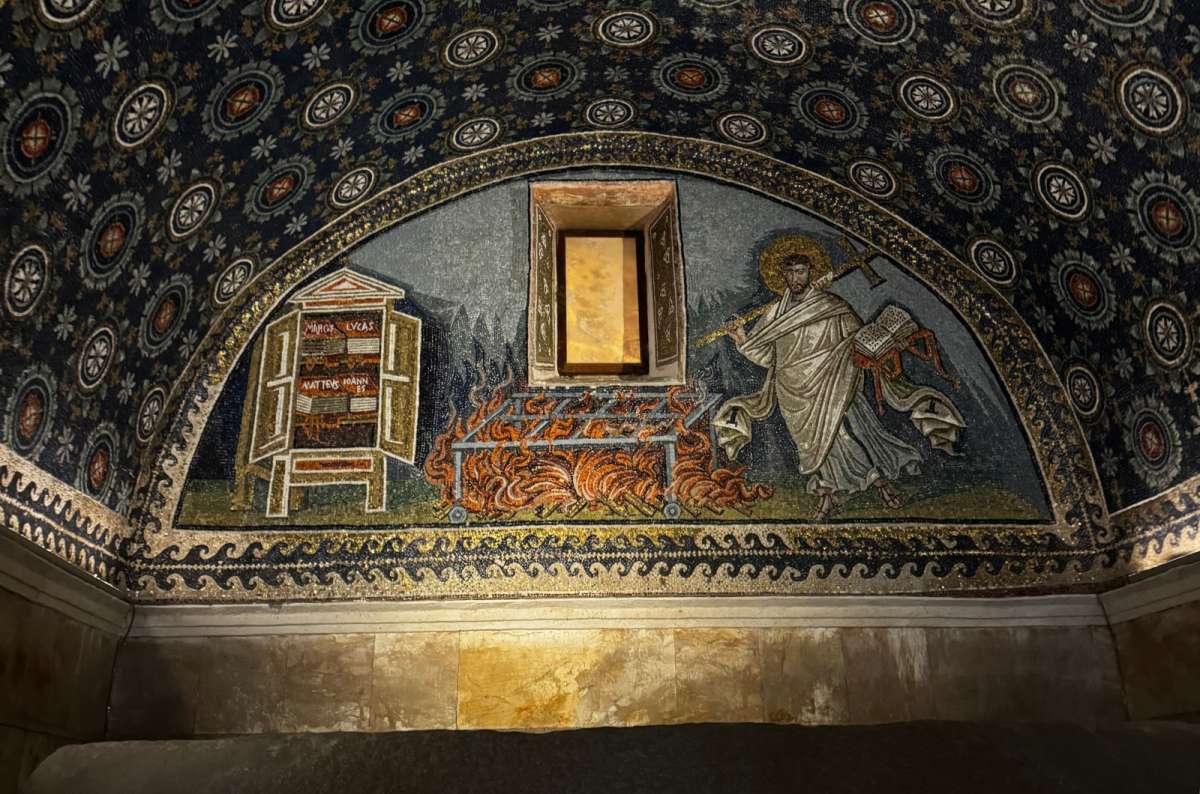 a photo of the starry blue mosaic vault and lunette inside the Mausoleum of Galla Placidia, Ravenna, Italy, photo by Next Level of Travel