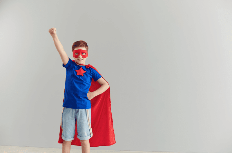A boy in superhero costume 