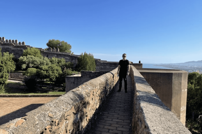 A tourist in Castillo de Gibralfaro—Andalusia itinerary 