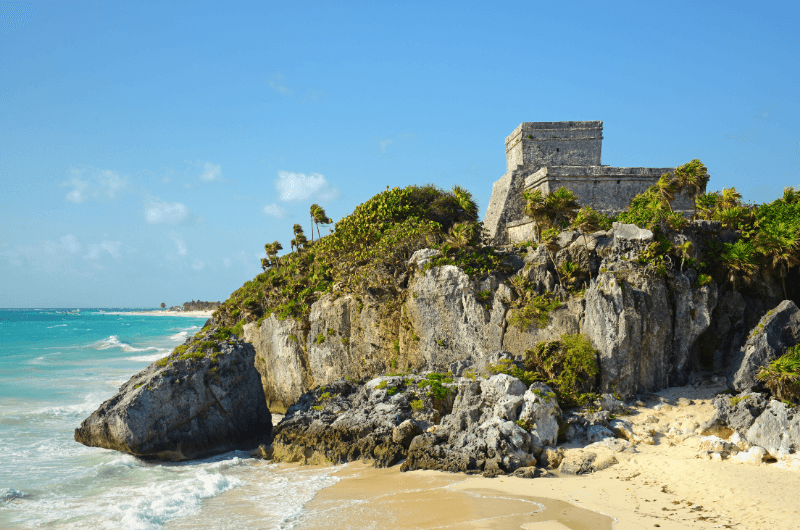 Ancient ruins of Tulum on a cliff by the sea in Mexico