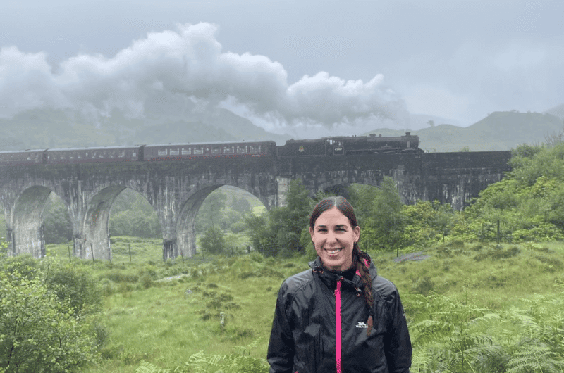 Glenfinnan Viaduct with steam train crossing over it
