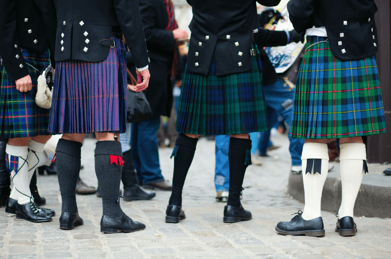 Different tartan patterns on kilts in Scotland