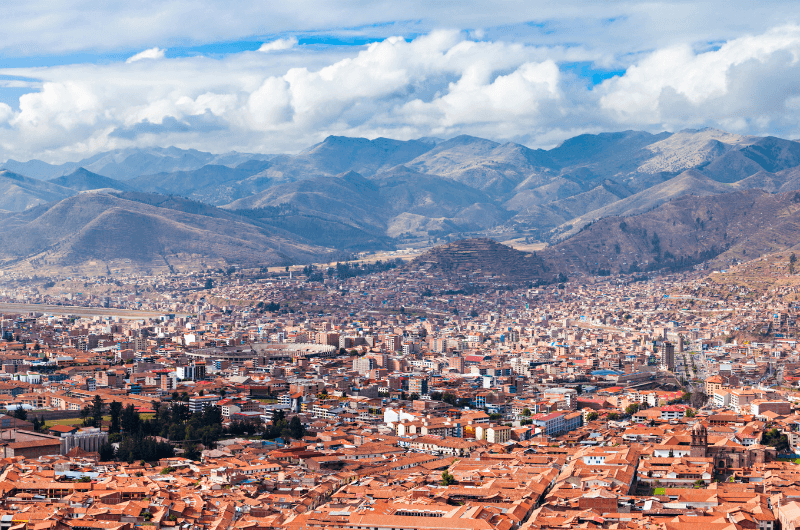 Aerial shot of Cusco with the Andes Mountains in the background 