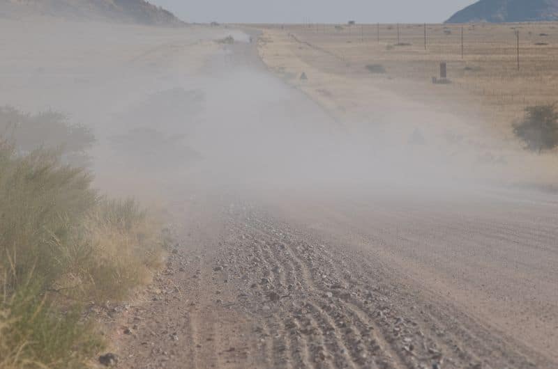 Dust cloud on the road in Namibia